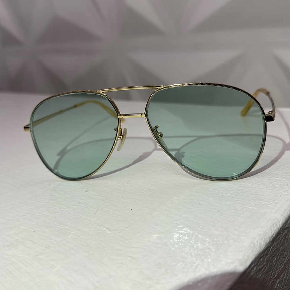 Gucci unisex blue lenses and gold frame